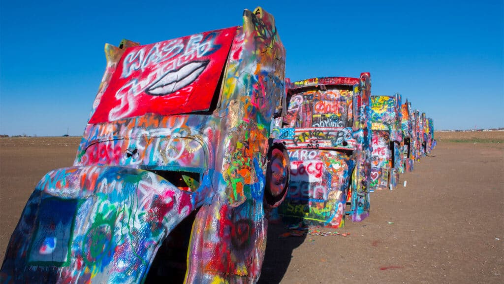 Family Road Trip Ideas - Cadillac Ranch a cool collection of old caddys stood up in a field that anyone can spray-paint their own designs on.