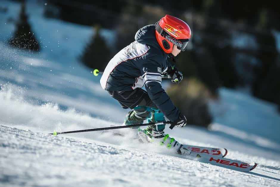 A picture of families skiing and snowboarding at Stowe Mountain Resort.