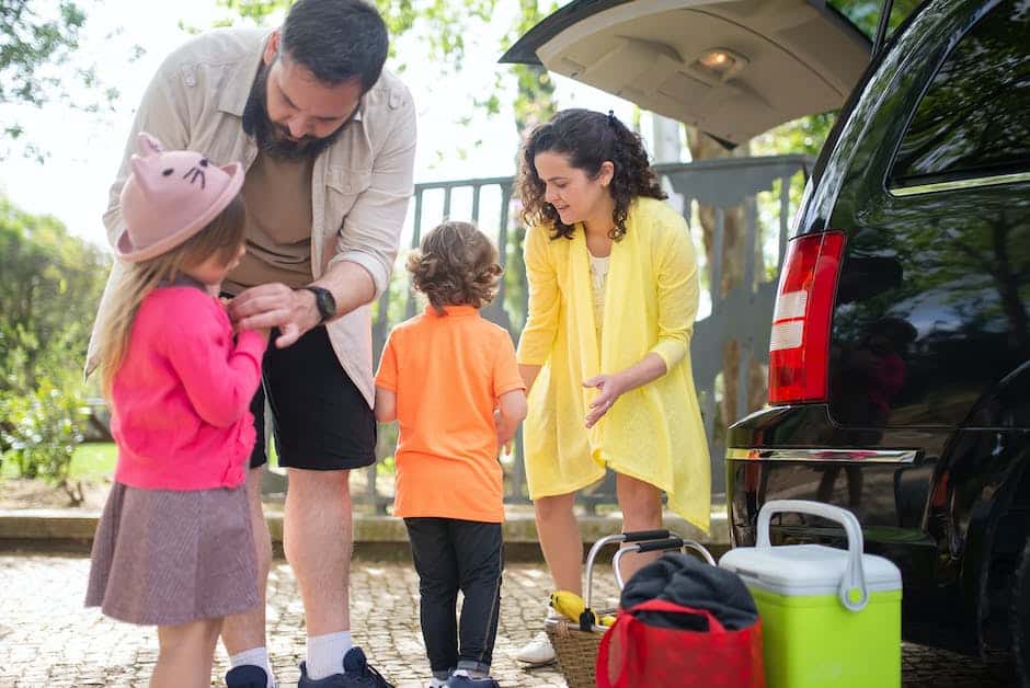 Healthy snacks for family travel - A family in a car, enjoying a road trip and snacking on Fruit and Nut Trail Mix.