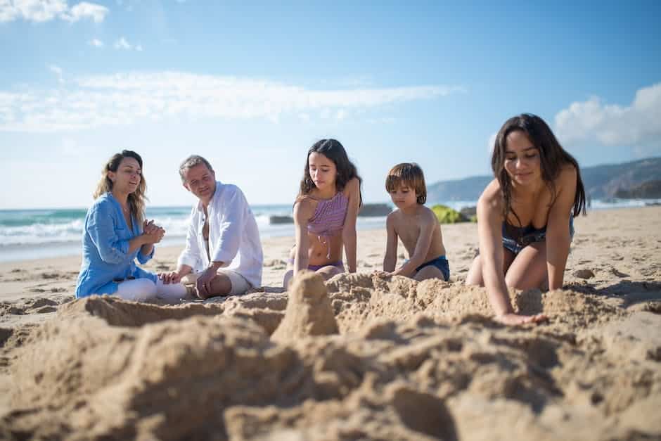 A family building sandcastles on a sunny beach on their East Coast vacation