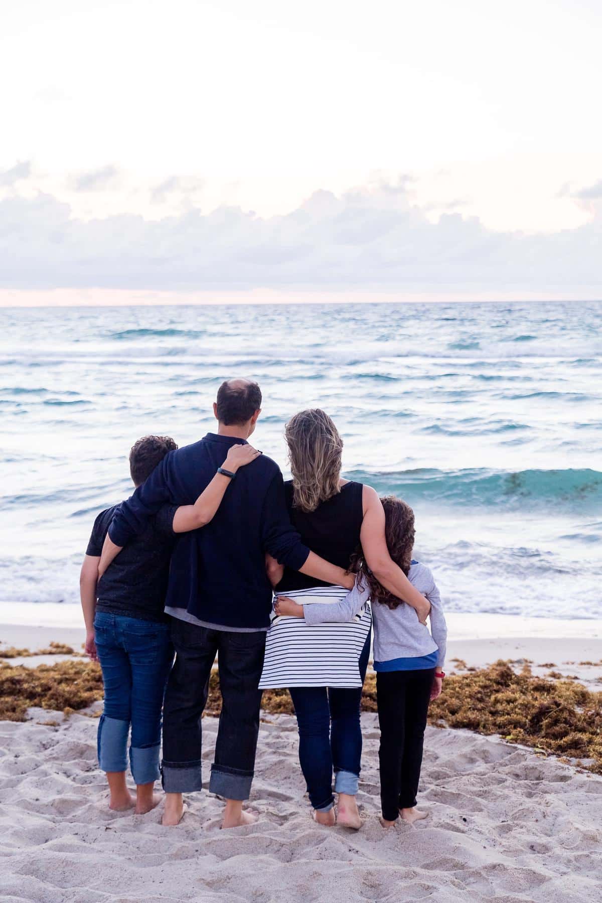 A happy family traveling together stress-free on the beach 