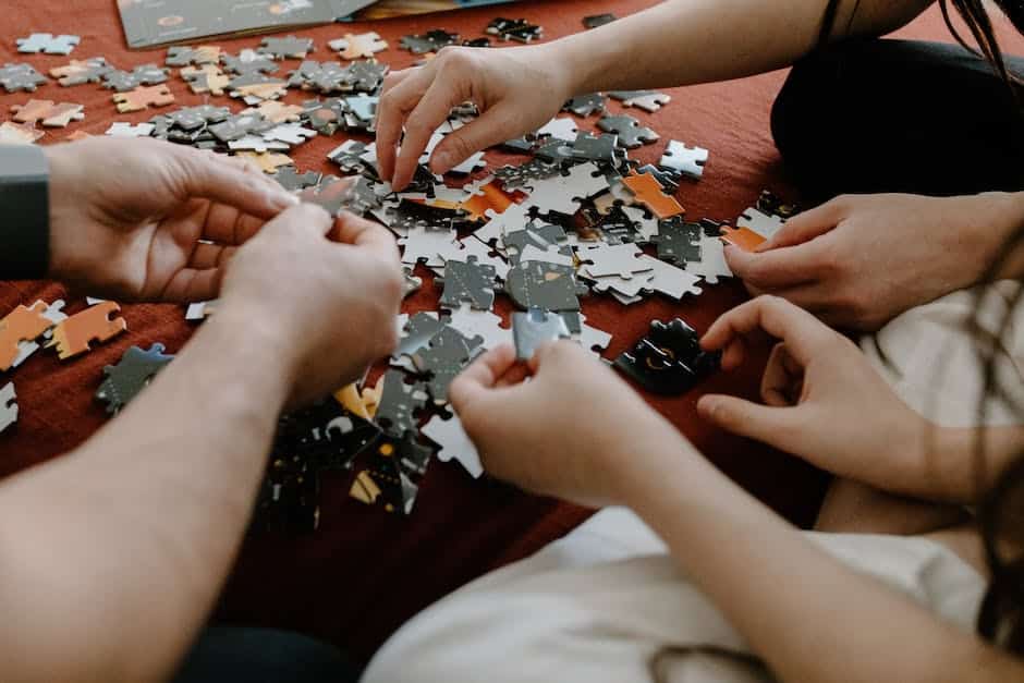 A group of people working together in a game room, solving puzzles and having fun.